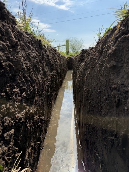 Deep sewer trench excavation by Hometown Flow Plumbing in Richards, Missouri