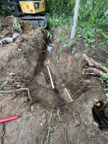 Sewer line excavation with mini excavator for a plumbing contractor in Richards, MO